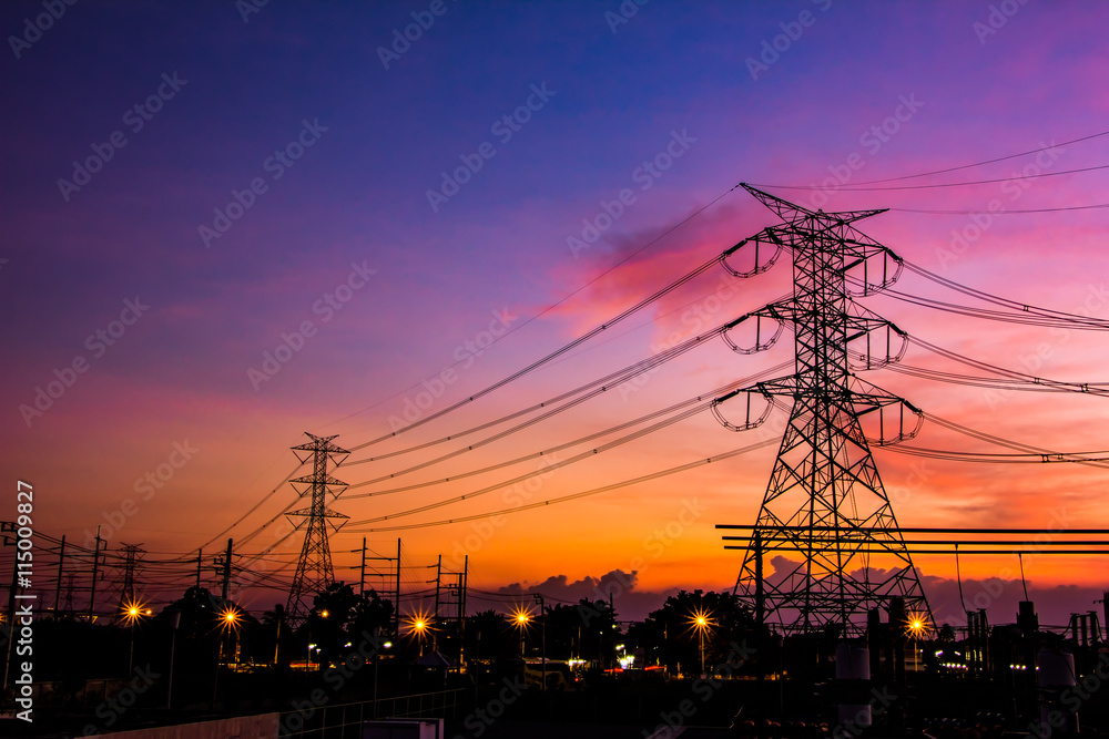 High voltage transmission lines. High voltage tower background at twilight.