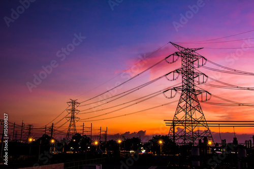 High voltage transmission lines. High voltage tower background at twilight.