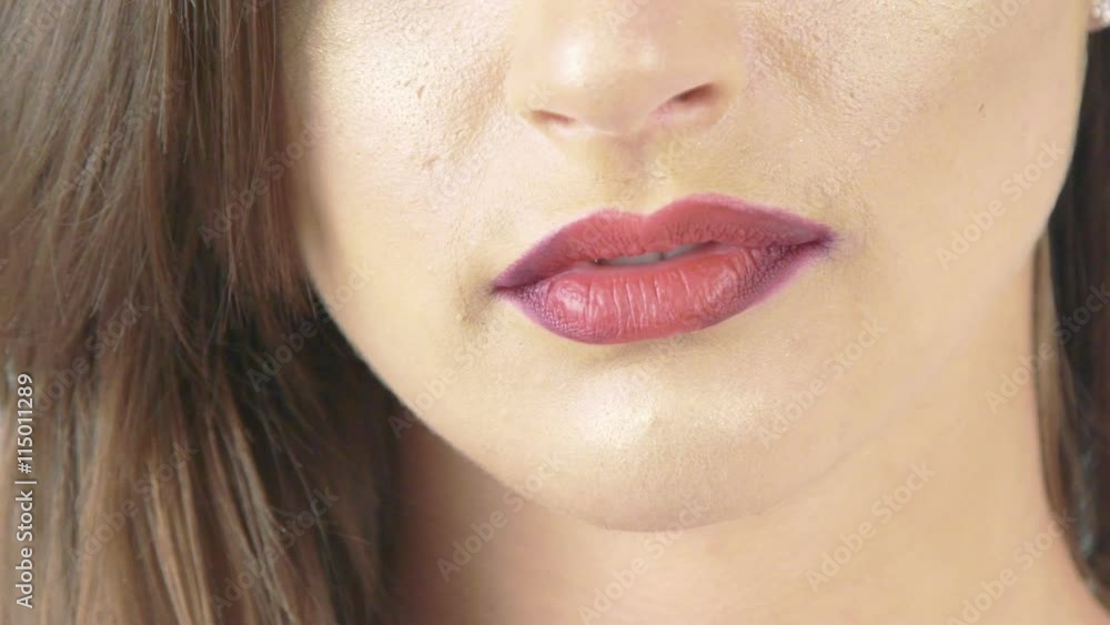 Close up of seductive claret lips. Slow motion Close up of seductive claret lips. Slow motion
