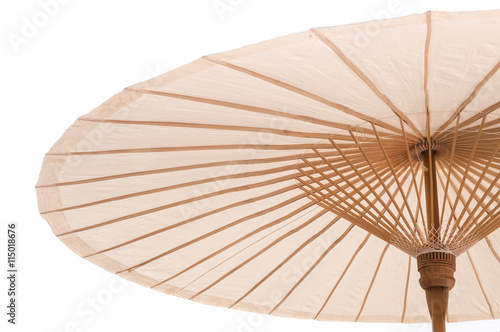 Traditional Asian paper and bamoo umbrella with a rounded handle on white background