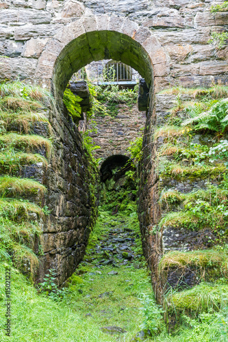 Water wheel Pit Pont y Pandy disused slate mill, north wales, UK photo