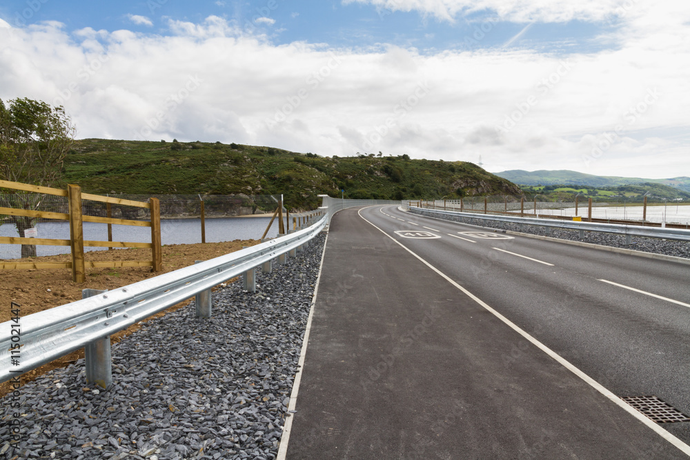 Fototapeta premium Railway and road over new river crossing, Pont Briwet bridge.