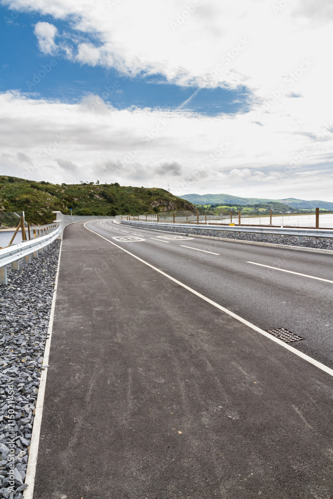 Fototapeta premium Railway and road over new river crossing, Pont Briwet bridge.