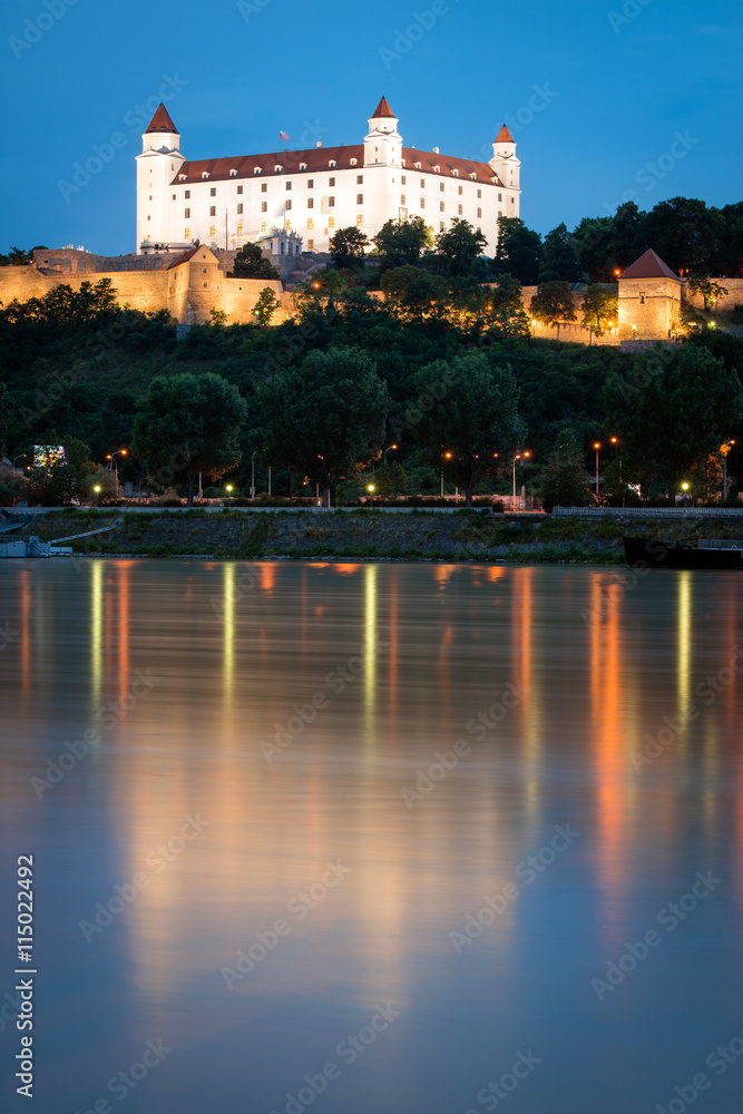 detail of Bratislava castle with it's reflection in Danube river, Slovakia