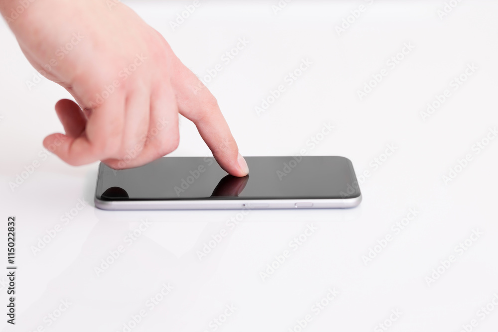 man holding a phone with isolated screen over the desk in the of man holding a phone with isolated screen over the desk in the of