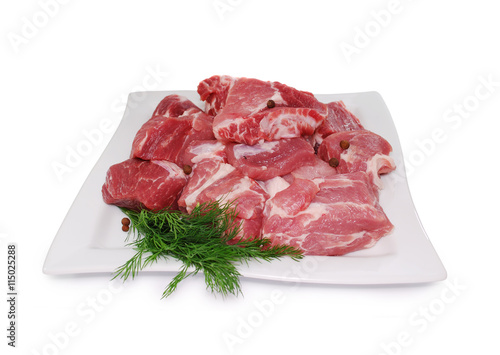 Raw Meat. Uncooked fresh pork slices isolated on white