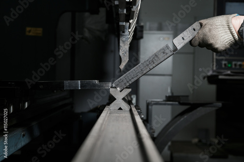 Fototapeta operator bending metal sheet by sheet bending machine