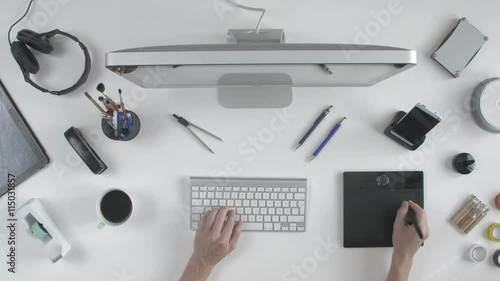 top view man architect 3D designer uses his pen tablet with his computer