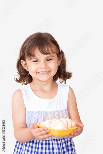 Happy girl presenting kahk el Eid ( Feast Cookies )