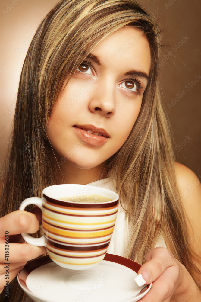 young pretty woman drinking coffee young pretty woman drinking coffee