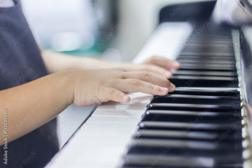 Obraz premium Children is playing piano