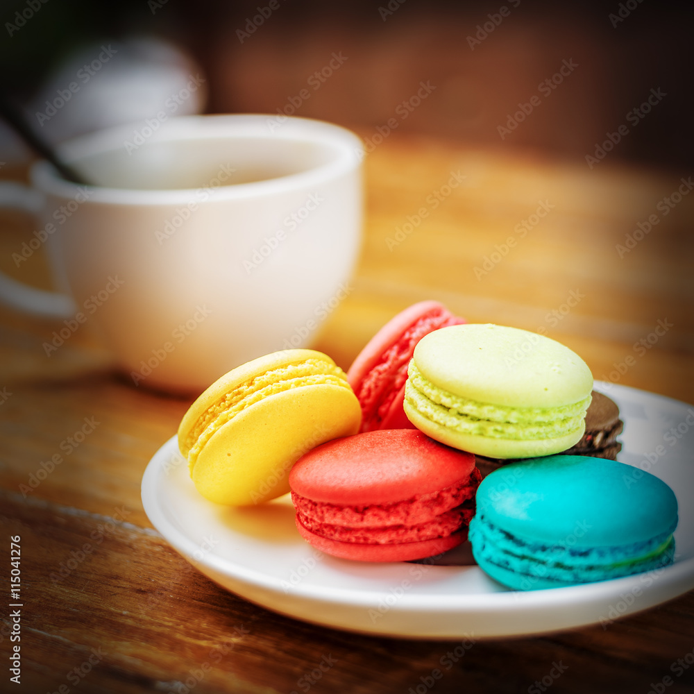 Fototapeta premium Macaroons on wood table,vintage tone