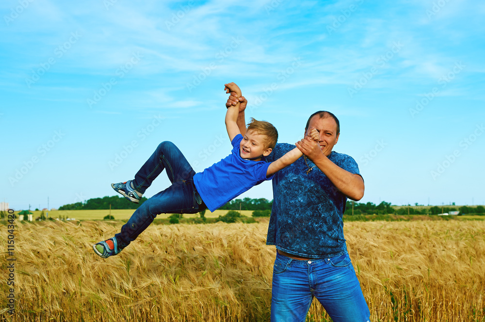 happy joyful father having fun throws up in the air child .In motion . father's day . happy joyful father having fun throws up in the air child .In motion . father's day .