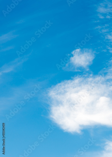 blue sky background with tiny clouds