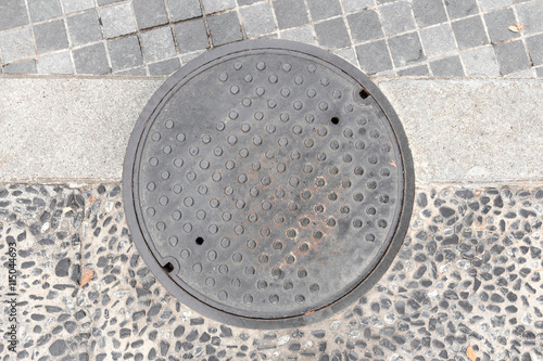 Rusty, grunge manhole cover