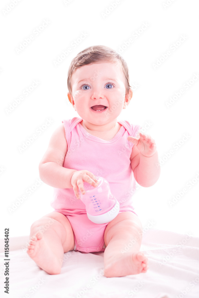 Baby girl with pink baby bottle. Baby girl with pink baby bottle.
