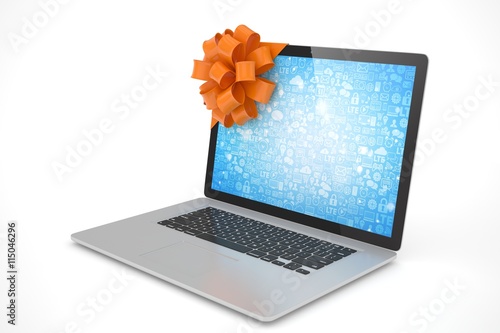 Foto Tied laptop with red bow on white background