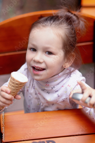 happy little girl eat ice-cream