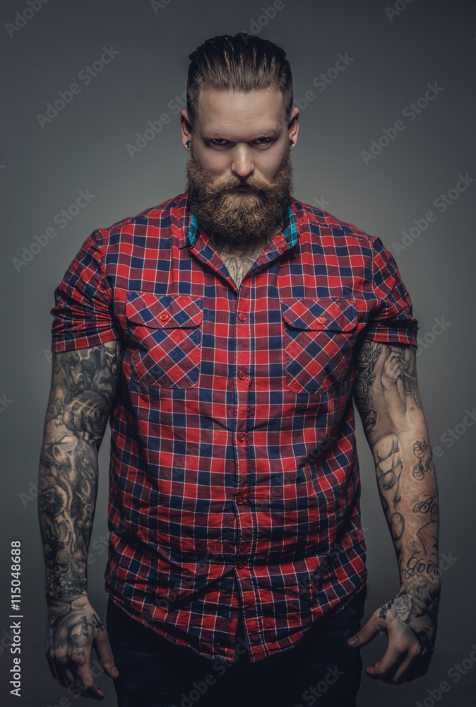 Fototapeta premium Tattooed male in a red shirt.