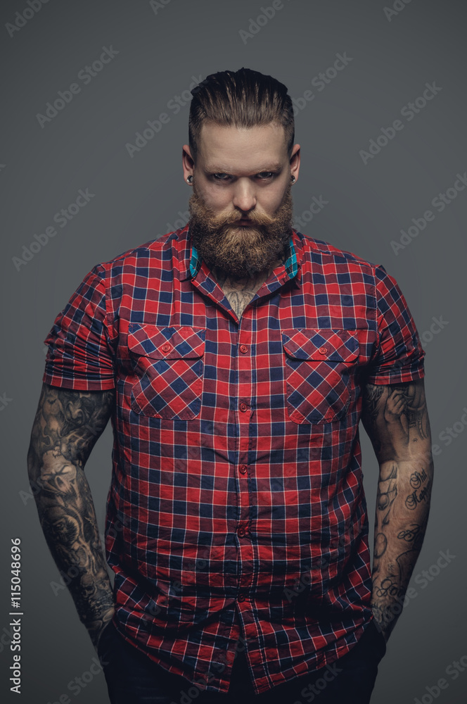 Fototapeta premium Tattooed male in a red shirt.