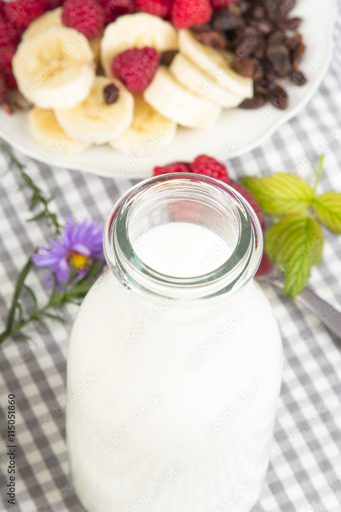 bottle of fresh milk and granola with fruits bottle of fresh milk and granola with fruits