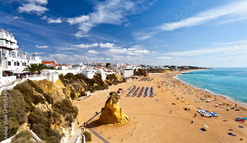 View of the old town of Albufeira and endless sandy beaches, Algarve, Portugal photo