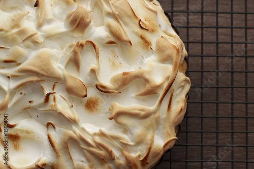 Lemon meringue pie on a cooling rack