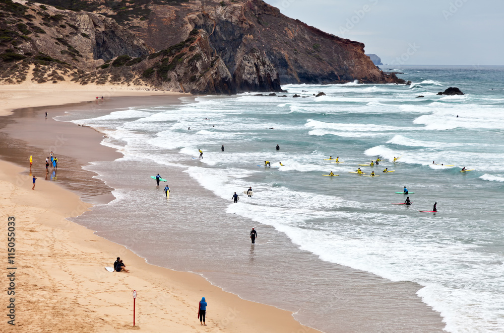 Obraz premium One of the best international schools surfers on the Atlantic coast of the Algarve near the town of Sagres on the beach Amado in the south of Portugal