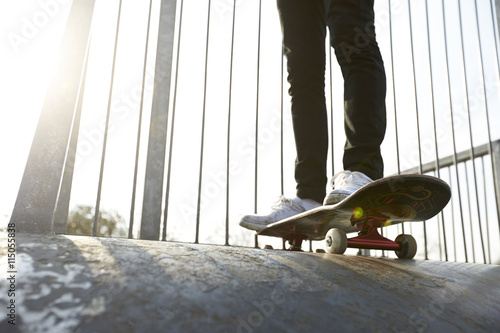Action Shot Of Skateboarder's Feet With Skateboard