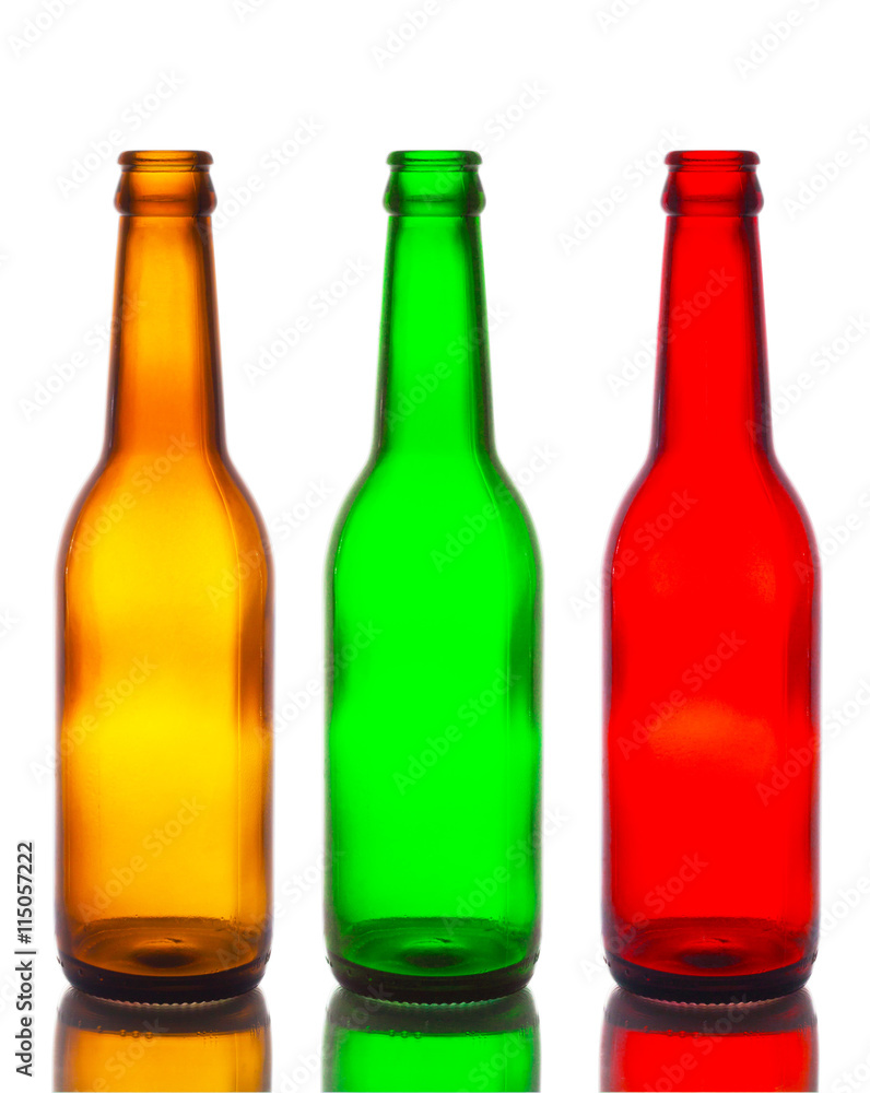 Empty bottles, brown, green and red isolated white backdrop. Empty bottles, brown, green and red isolated white backdrop.
