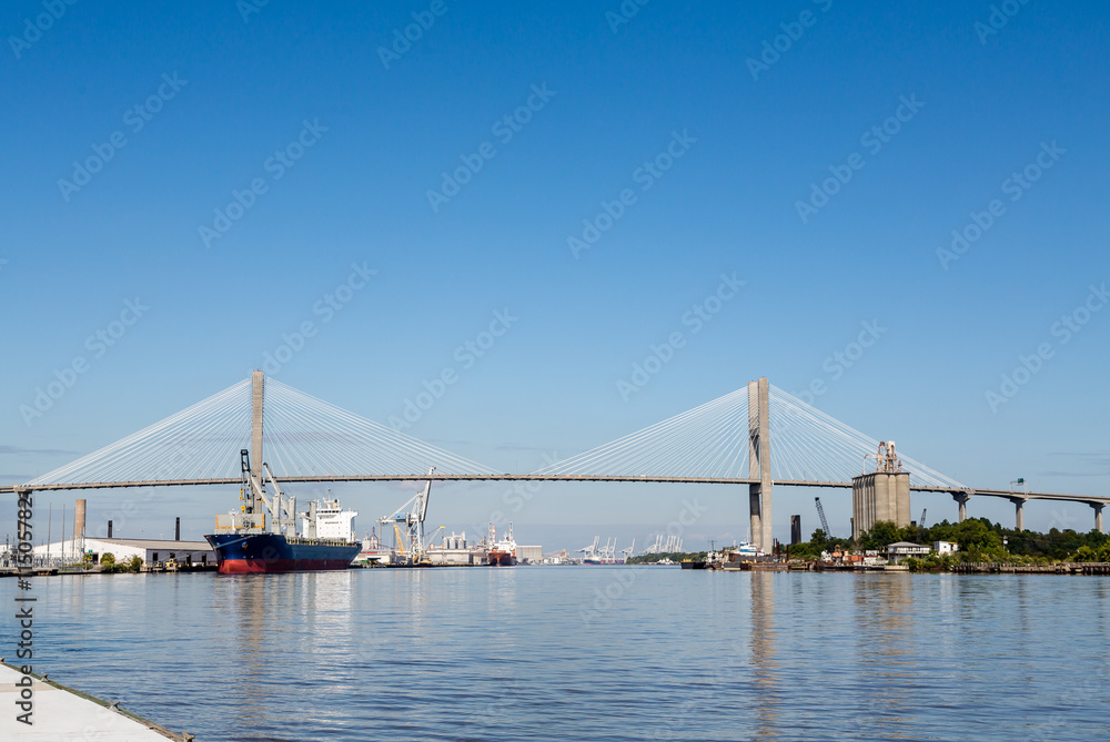 Industrial Harbor Under Suspension Bridge