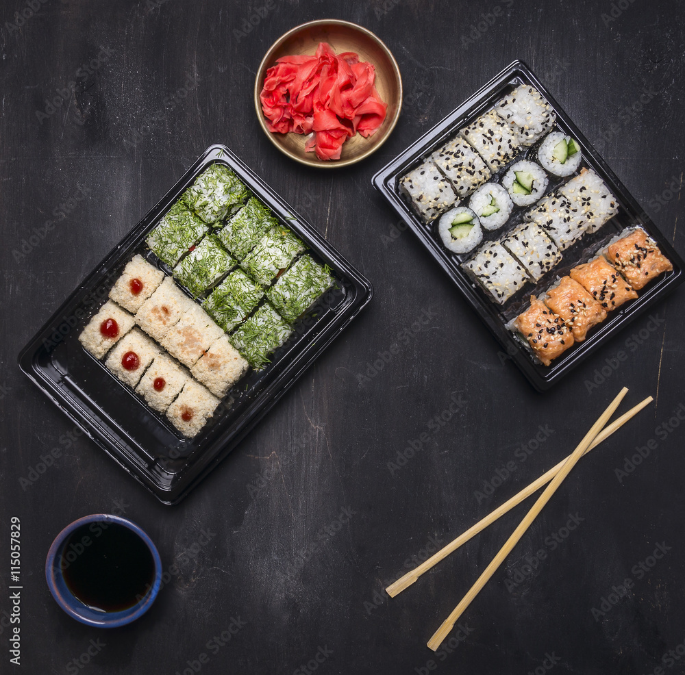 Bento lunchbox Japanese style quick meal that plenty of good nutrition, Various sushi roll with cucumber, salmon and crab on wooden rustic background top view close up