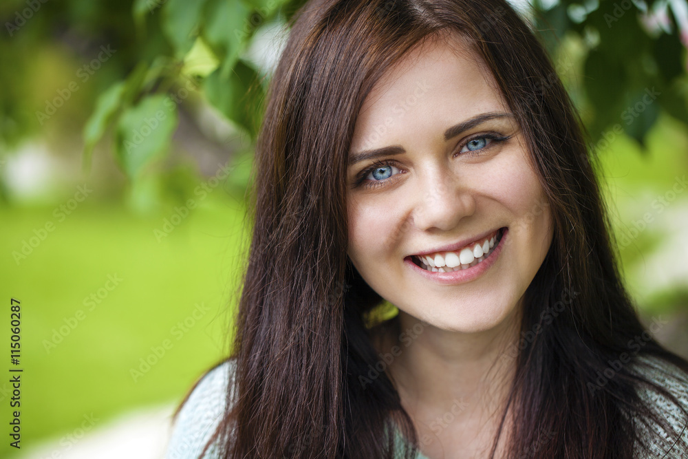 Closeup portrait of a happy young woman smiling Closeup portrait of a happy young woman smiling