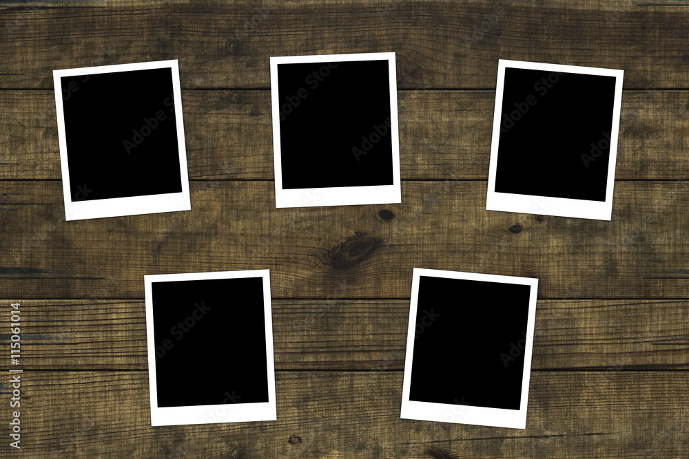 Old photos on distressed wood background Old photos on distressed wood background