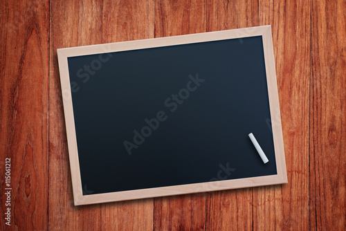 Black chalkboard on wood table