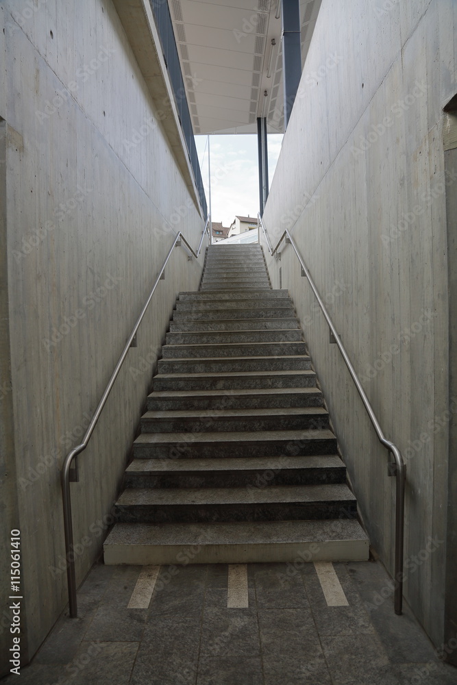Exiting underground tunnel in the form of a gray concrete stairs