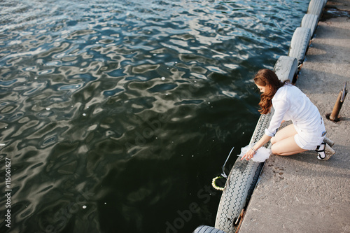 Girl at bachelorette party let the wreaths on the water