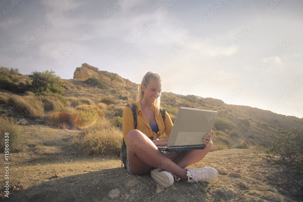 Girls with laptop outdoors