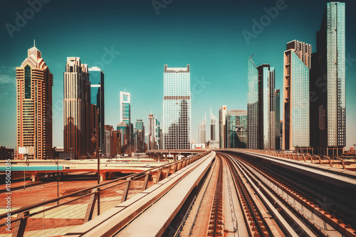 Modern architecture of Dubai  UAE  seen from a metro car. Scenic view of the Dubai skyscrapers. Travel background.