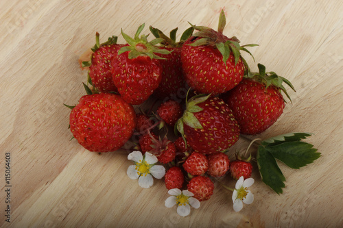 wild strawberry on wooden background