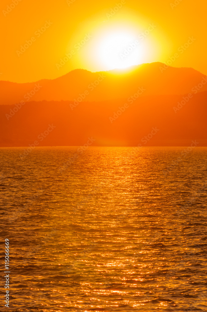 Sunset over mountain  with lake