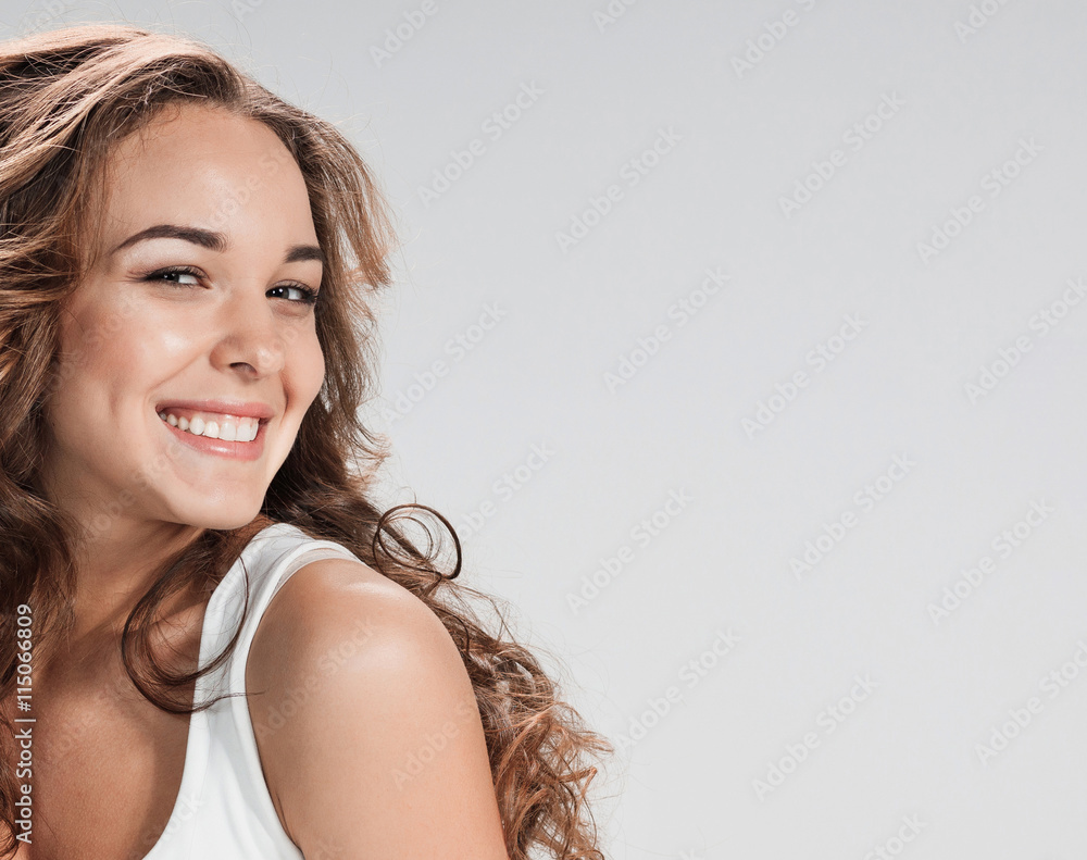The young woman's portrait with happy emotions The young woman's portrait with happy emotions