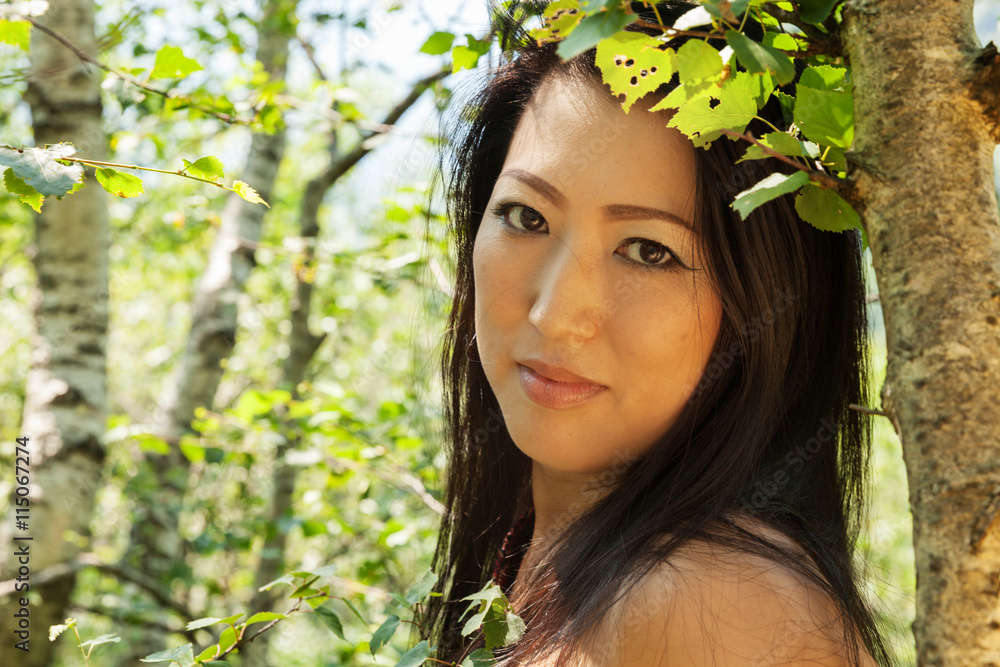 Asian girl portrait outdoors in the forest Asian girl portrait outdoors in the forest