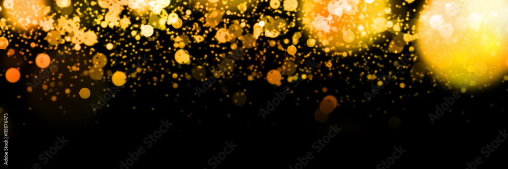 banner with bright orange bokeh effects in front of a black background
