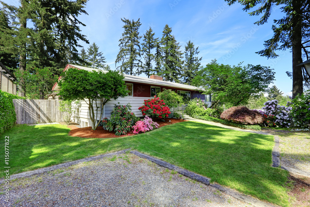 Fototapeta premium Red and white modern house exterior with driveway