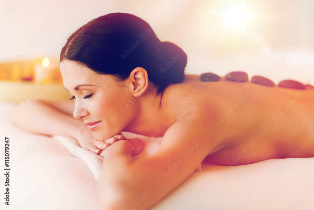 Obraz premium woman in spa with hot stones