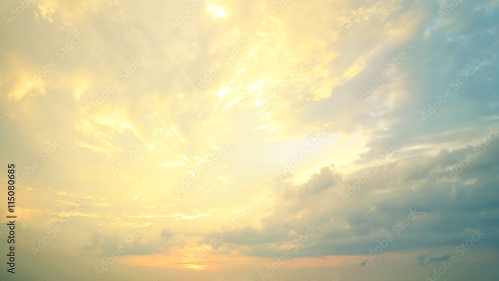 Fototapeta premium A new heaven and earth concept: Dramatic sun ray with yellow sky and clouds dawn texture background