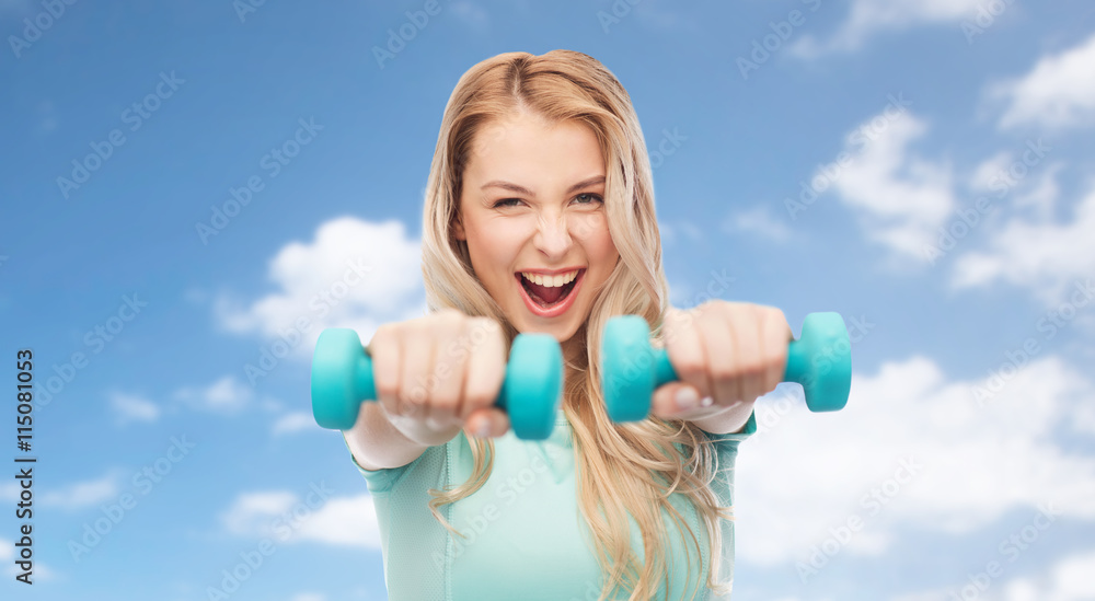 smiling beautiful young sporty woman with dumbbell smiling beautiful young sporty woman with dumbbell
