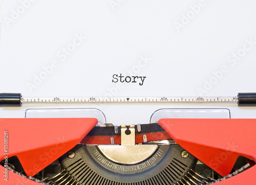 close up image of typewriter with paper sheet and word Story. 