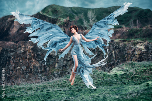 Foto Girl angel with beautiful wings fly floating soaring in air